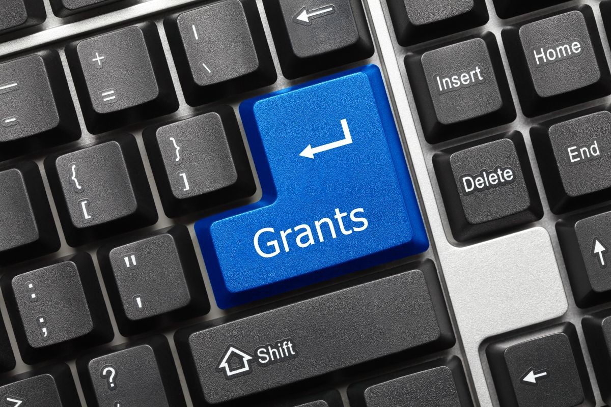 Close-up view on conceptual keyboard - Grants (blue key)